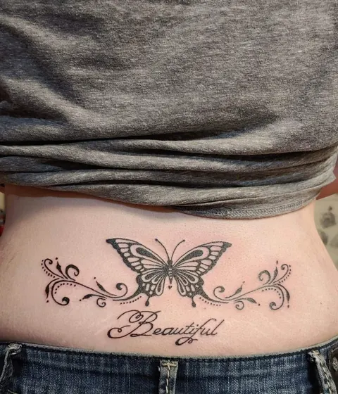 Butterfly with scrollwork and the word Beautiful on the lower back
