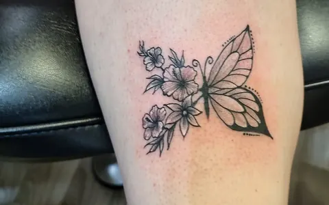 Butterfly with one wing made of flowers, fine line