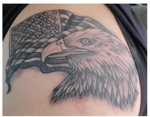 Eagle head over an American flag, black and gray