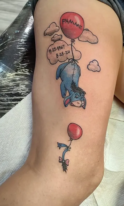 Eeyore holding a red balloon with dates in a cloud, in color