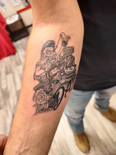 Motorcycle rider with roses on the forearm, black and gray
