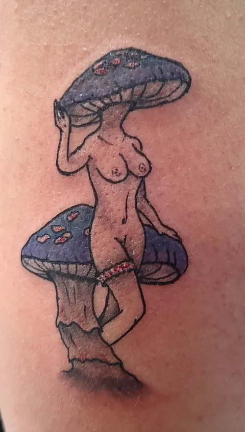 Pinup with a blue mushroom cap on the upper arm