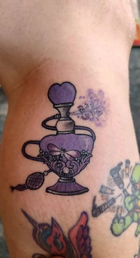 Purple potion bottle with butterflies, in color