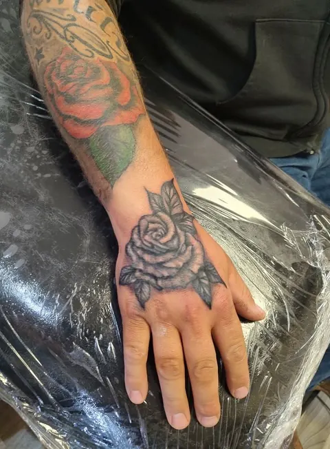 Rose on the back of the hand, black and gray