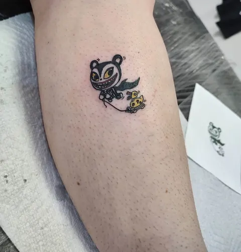 Small cartoon character on the leg, in color