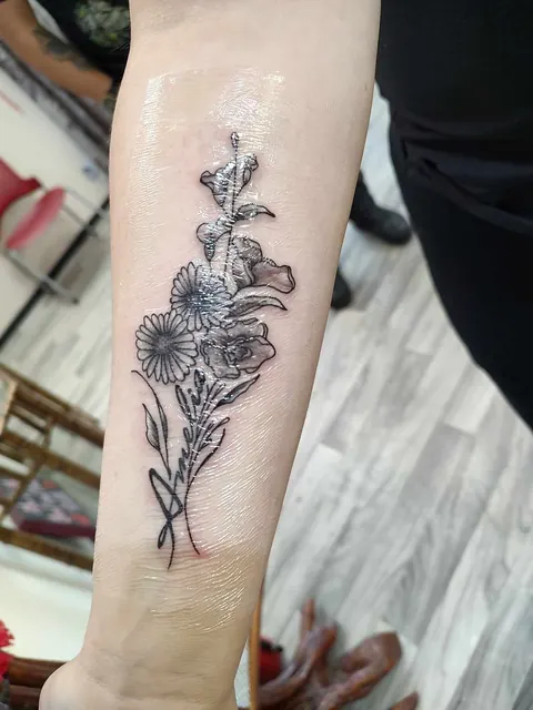 Wildflowers up the forearm, fine line